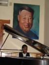 Rudel Drears below the Duke Ellington Portrait by Sid Catlett's nephew, Sid Brown, on sale at EZ's Woodshed.